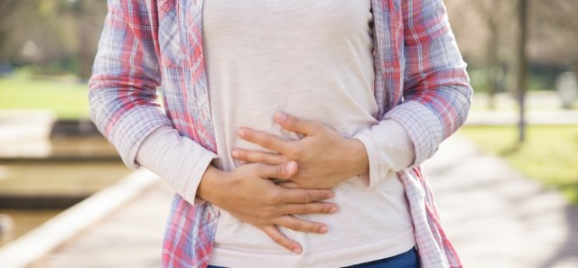 Woman suffering from bellyache